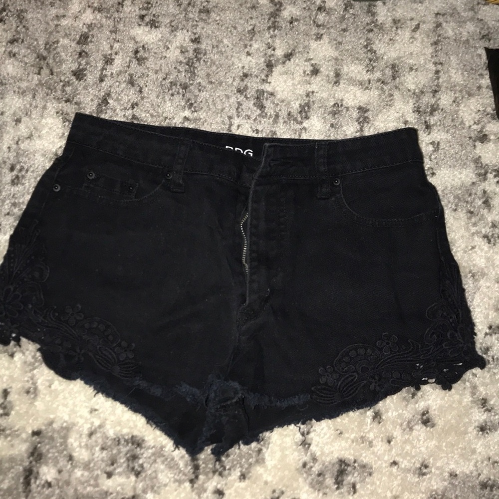 Black shorts with floral lace ends